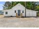 Charming home exterior with a well-maintained yard and inviting entrance steps at 7227 Cleveland Rd Rd, Clayton, NC 27520