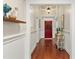 Elegant hallway with hardwood floors, wainscoting, and stylish decor at 7227 Cleveland Rd Rd, Clayton, NC 27520