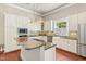 Modern kitchen features granite countertops, stainless steel appliances, and island cooktop at 7227 Cleveland Rd Rd, Clayton, NC 27520