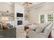 Cozy living room featuring fireplace and built-in shelving at 7227 Cleveland Rd Rd, Clayton, NC 27520