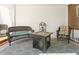 Covered patio featuring wicker seating, a decorative fire pit, and outdoor rug at 7227 Cleveland Rd Rd, Clayton, NC 27520