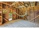 A backyard shed with a hammock, wooden walls, and patterned rug provides a cozy and unique space at 7227 Cleveland Rd Rd, Clayton, NC 27520