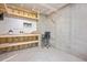 Unfinished basement area showing potential for customization, workspace with workbench, and storage solutions at 7616 Satinwing Ln, Raleigh, NC 27617
