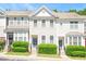 Charming townhome featuring well-maintained landscaping and inviting curb appeal at 7616 Satinwing Ln, Raleigh, NC 27617