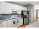 Well-equipped kitchen featuring modern appliances and plenty of counter space at 7616 Satinwing Ln, Raleigh, NC 27617