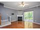 Cozy living room featuring a fireplace and access to an outdoor deck at 7616 Satinwing Ln, Raleigh, NC 27617