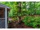 Backyard featuring lush garden beds and seating areas, creating a peaceful outdoor oasis at 8 Wexford Dr, Durham, NC 27713