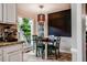 Eat-in dining area features a chalkboard wall, a pendant light, and views of the wooded yard at 8 Wexford Dr, Durham, NC 27713