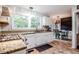 Well-maintained kitchen showcasing granite countertops and modern appliances at 8 Wexford Dr, Durham, NC 27713