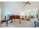 Spacious living room with high ceilings and a piano, leading into the dining area at 8 Wexford Dr, Durham, NC 27713