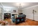 Bright living room with a fireplace, hardwood floors, and comfortable seating at 8 Wexford Dr, Durham, NC 27713