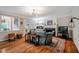 Spacious living room with fireplace, hardwood floors, and access to the backyard at 8 Wexford Dr, Durham, NC 27713