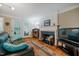 Comfortable living area with fireplace, hardwood floors, and natural light at 8 Wexford Dr, Durham, NC 27713