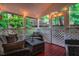 Relaxing porch with comfortable seating and ambient string lights, ideal for outdoor enjoyment at 8 Wexford Dr, Durham, NC 27713