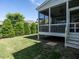 Lovely back porch with screen and a well maintained, grassy backyard at 8461 Lentic Ct, Raleigh, NC 27615