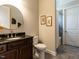 Bathroom with a granite countertop vanity and a shower/tub with tiled surround at 8461 Lentic Ct, Raleigh, NC 27615