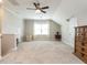 Spacious bonus room featuring neutral colors, a ceiling fan, and natural light at 8461 Lentic Ct, Raleigh, NC 27615
