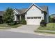 Beautiful two-story home with a two-car garage, lush lawn, and tasteful landscaping at 8461 Lentic Ct, Raleigh, NC 27615