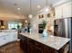 Gourmet kitchen featuring a large island, stainless steel appliances, and custom cabinetry at 8461 Lentic Ct, Raleigh, NC 27615