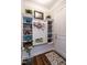 Mudroom featuring built-in shelving, a bench, and a hardwood floor at 8461 Lentic Ct, Raleigh, NC 27615