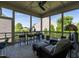 Screened porch with outdoor furniture and views of the backyard at 8461 Lentic Ct, Raleigh, NC 27615