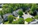 An aerial view of a suburban home featuring a private pool and mature landscaping at 8724 Deerland Grove Dr, Raleigh, NC 27615