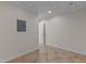 Spacious basement area with tile flooring, neutral walls and bright ceiling lighting at 8724 Deerland Grove Dr, Raleigh, NC 27615