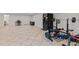 Finished basement featuring a home gym, tile flooring and recreational space at 8724 Deerland Grove Dr, Raleigh, NC 27615