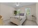 Comfortable bedroom with a cozy bed, neutral colors and natural lighting at 8724 Deerland Grove Dr, Raleigh, NC 27615