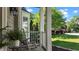 Cozy porch with rocking chair, surrounded by lush greenery, offering a relaxing outdoor space at 8724 Deerland Grove Dr, Raleigh, NC 27615
