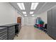 Spacious garage area with cabinets, storage and workspace offers ample room for projects and organization at 8724 Deerland Grove Dr, Raleigh, NC 27615