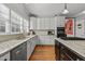 Bright kitchen with granite countertops, stainless steel dishwasher and oven, and a wooden island, filled with sunlight at 8724 Deerland Grove Dr, Raleigh, NC 27615