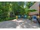 Charming backyard patio offers a perfect spot for relaxation with comfortable seating and a serene ambiance at 8724 Deerland Grove Dr, Raleigh, NC 27615