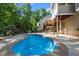 Private pool in a lush backyard, with ample patio space for relaxing and entertaining guests at 8724 Deerland Grove Dr, Raleigh, NC 27615