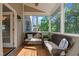 Relaxing screened-in porch with comfortable seating and view of backyard at 8724 Deerland Grove Dr, Raleigh, NC 27615