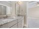 This bathroom features granite countertops and double sinks at 937 Sedgefield Park Ln, Cary, NC 27519