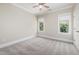 A bonus room with two windows and carpet at 937 Sedgefield Park Ln, Cary, NC 27519