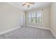 A bonus room with a window and carpet at 937 Sedgefield Park Ln, Cary, NC 27519
