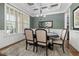 Elegant dining room with coffered ceiling, stylish chandelier, and large windows, ideal for formal gatherings at 937 Sedgefield Park Ln, Cary, NC 27519