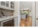Open-concept kitchen with granite counters, stainless steel appliances, and stylish bar seating, perfect for entertaining at 937 Sedgefield Park Ln, Cary, NC 27519
