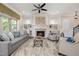 Spacious living room featuring a fireplace, built-in bookshelves, and stylish furniture at 937 Sedgefield Park Ln, Cary, NC 27519