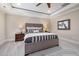 Comfortable main bedroom featuring a tufted headboard, neutral tones, and soft lighting at 937 Sedgefield Park Ln, Cary, NC 27519