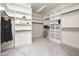 This spacious walk-in closet has built in shelving at 937 Sedgefield Park Ln, Cary, NC 27519
