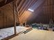 Spacious attic with exposed rafters, insulation and wood flooring, offering ample storage at 95 Live Oak Dr, Louisburg, NC 27549