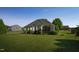 Sprawling backyard featuring a covered patio, mature trees and manicured shrubs at 95 Live Oak Dr, Louisburg, NC 27549