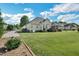 Large grassy backyard with mature trees, ideal for outdoor activities at 95 Live Oak Dr, Louisburg, NC 27549