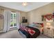 Comfortable bedroom with natural light from a large window at 95 Live Oak Dr, Louisburg, NC 27549