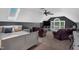 Bonus room with skylights, a ceiling fan and two leather armchairs at 95 Live Oak Dr, Louisburg, NC 27549