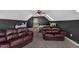 Lofted bonus room has two leather couches and skylight at 95 Live Oak Dr, Louisburg, NC 27549