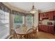 Cozy dining area features a chandelier and natural light at 95 Live Oak Dr, Louisburg, NC 27549